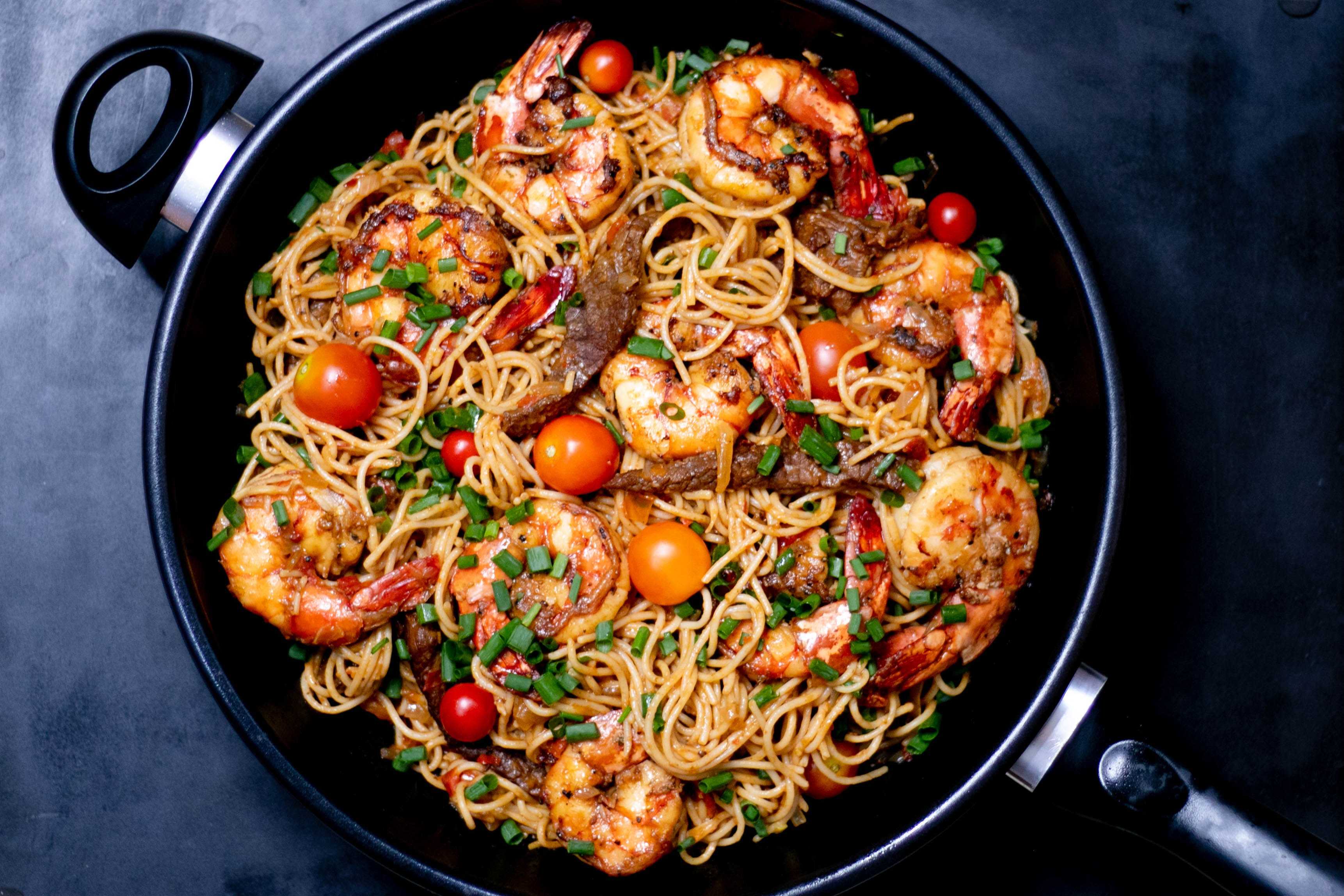 Paella with spaghetti pasta